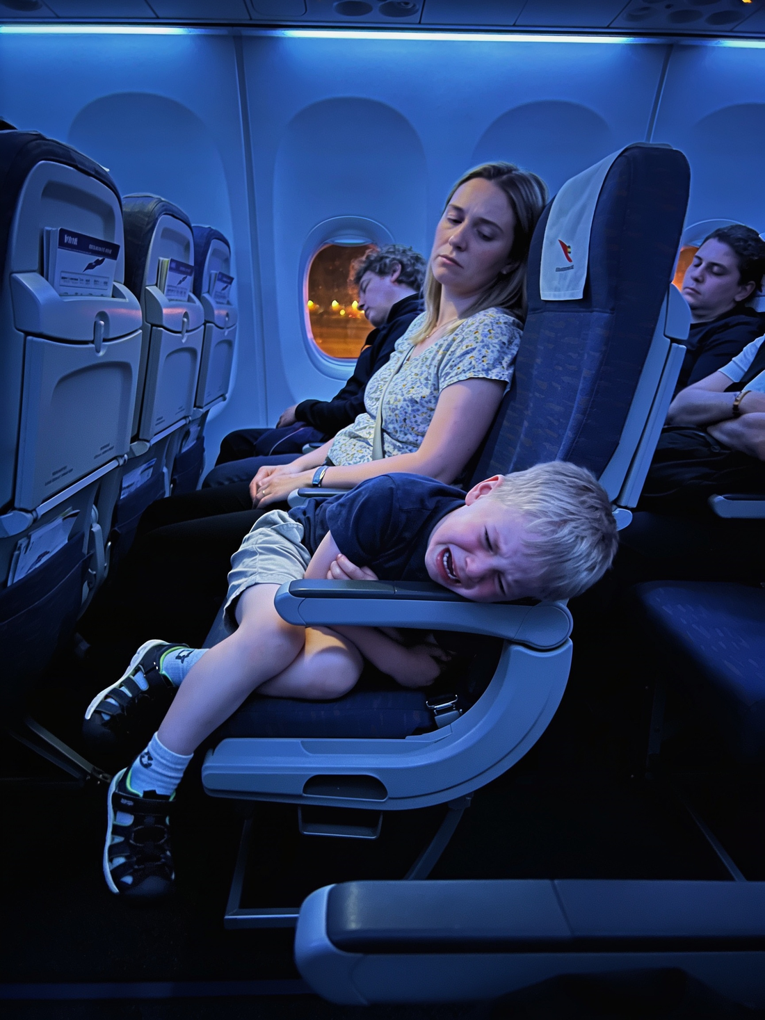 Exhausted parent on a long flight